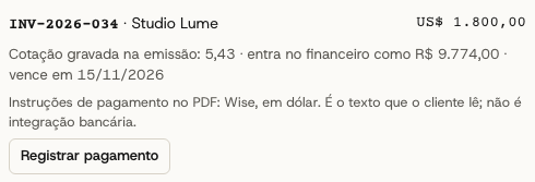 Invoice INV-2026-034 de US$ 1.800,00 para um cliente dos Estados Unidos, com a cotação de 5,43 gravada na emissão e o botão para registrar o pagamento